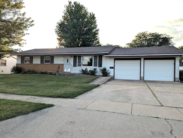 108 Janet Ave, Rochelle, IL 61068 - ranch-style house with an attached garage, driveway, a front lawn, and brick siding