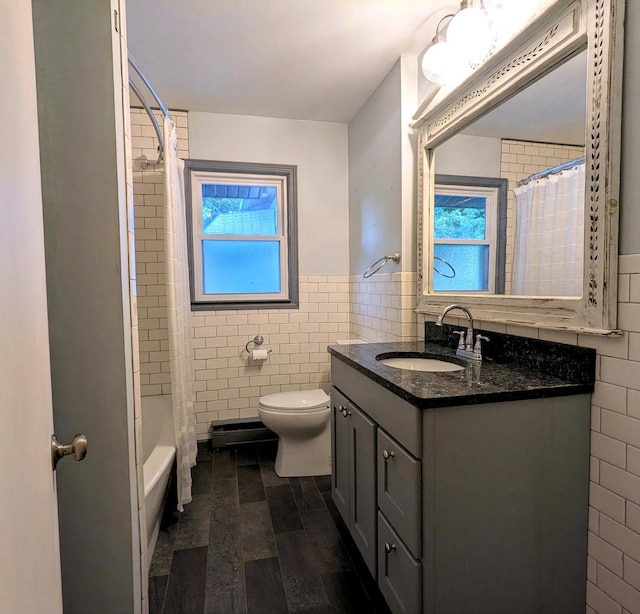 108 Janet Ave, Rochelle, IL 61068 - full bath featuring tile walls, vanity, a wainscoted wall, and shower / bath combo with shower curtain