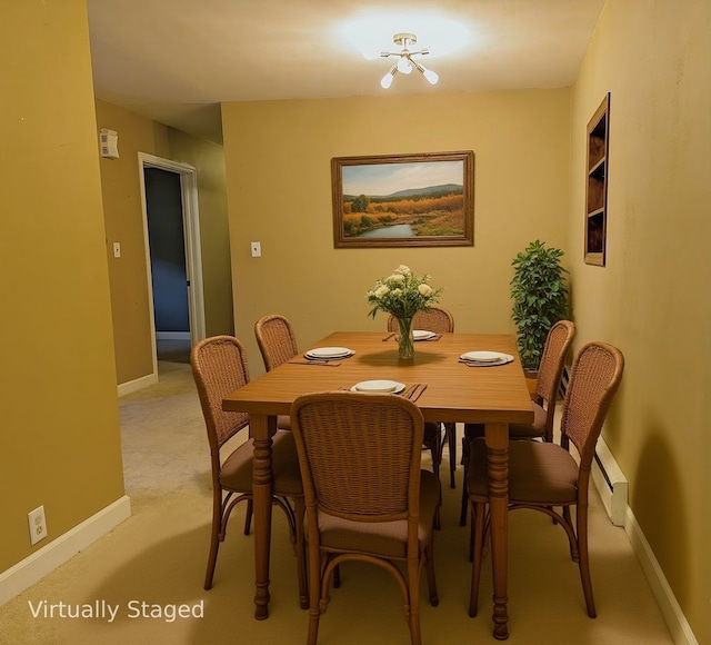 108 Janet Ave, Rochelle, IL 61068 - dining space featuring light carpet and baseboard heating