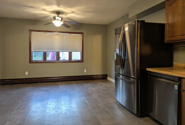108 Janet Ave, Rochelle, IL 61068 - kitchen featuring appliances with stainless steel finishes, a ceiling fan, baseboard heating, and light countertops