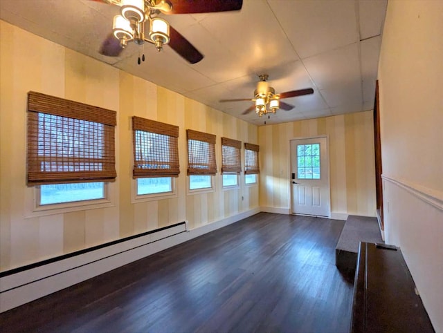 108 Janet Ave, Rochelle, IL 61068 - unfurnished room featuring a ceiling fan, dark wood-type flooring, and baseboard heating