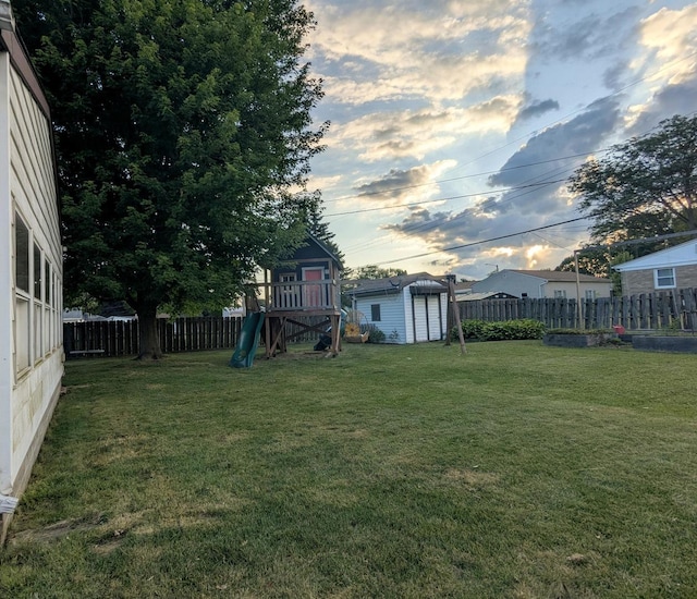108 Janet Ave, Rochelle, IL 61068 - fenced backyard featuring a shed and a playground