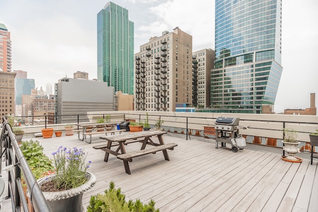 1020 S Wabash Ave Unit 7C, Chicago, IL 60605 - wooden deck featuring a skyline view, grilling area, and outdoor dining area