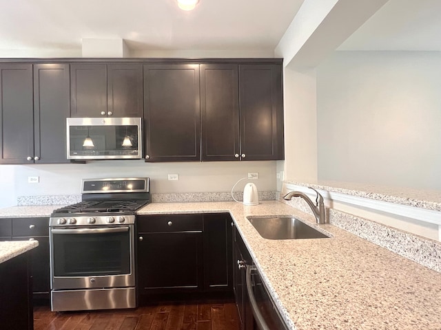 4182 Royal Mews Cir, Naperville, IL 60564 - kitchen with stainless steel appliances, light stone counters, dark wood-style floors, and a peninsula