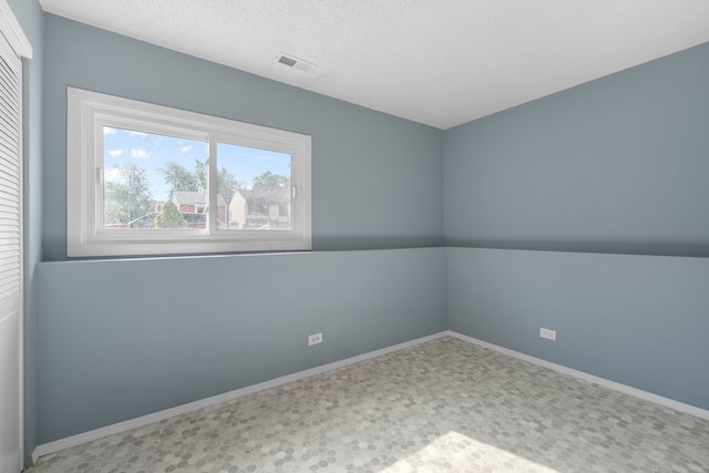 2S464 Cottonwood Ct, Warrenville, IL 60555 - empty room with baseboards and a textured ceiling