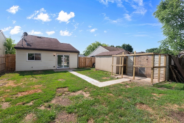2S464 Cottonwood Ct, Warrenville, IL 60555 - rear view of house with a fenced backyard, an outdoor structure, and exterior structure