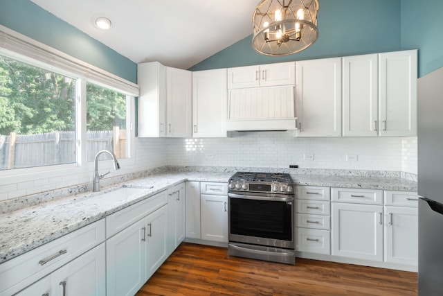 2S464 Cottonwood Ct, Warrenville, IL 60555 - kitchen with stainless steel appliances, lofted ceiling, a chandelier, white cabinets, and custom exhaust hood