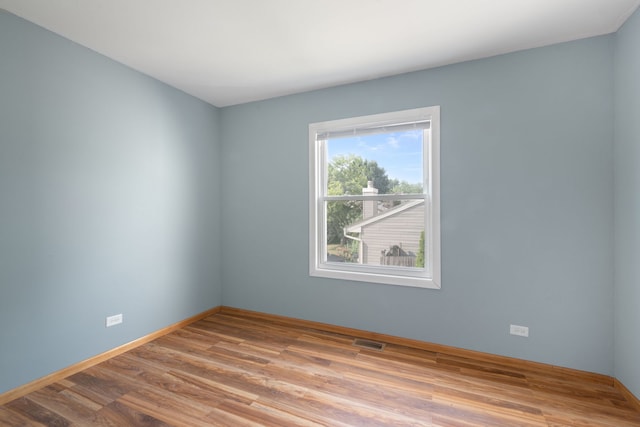 2S464 Cottonwood Ct, Warrenville, IL 60555 - spare room with wood finished floors and baseboards