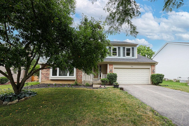 711 W Nichols Rd, Arlington Heights, IL 60004 - view of front of home with asphalt driveway, brick siding, a front lawn, an attached garage, and roof with shingles