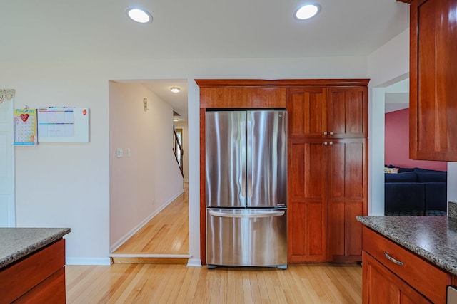 711 W Nichols Rd, Arlington Heights, IL 60004 - kitchen featuring freestanding refrigerator, light wood-style floors, recessed lighting, and brown cabinetry