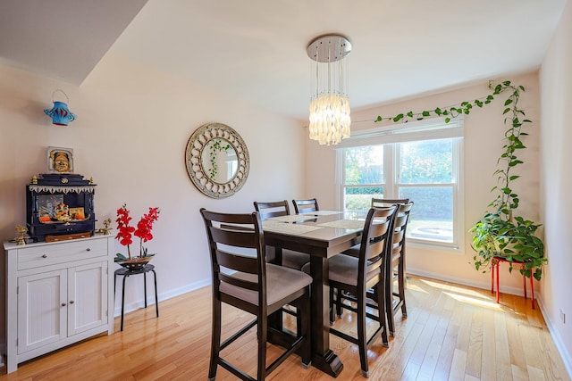 711 W Nichols Rd, Arlington Heights, IL 60004 - dining room featuring a chandelier and light wood-style floors