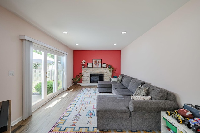 711 W Nichols Rd, Arlington Heights, IL 60004 - living room featuring light wood-style flooring, recessed lighting, and a stone fireplace