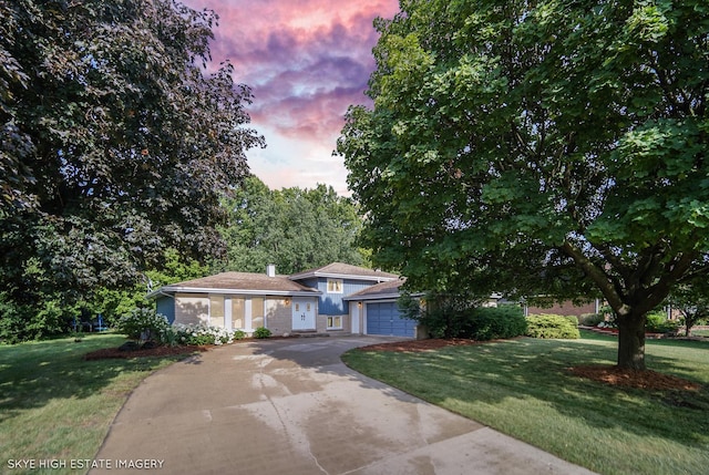353 Eagle Ln, Bloomingdale, IL 60108 - tri-level home featuring an attached garage, a yard, and driveway