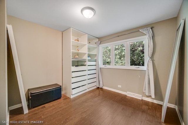 353 Eagle Ln, Bloomingdale, IL 60108 - unfurnished bedroom featuring wood finished floors and baseboards