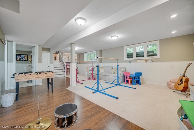 353 Eagle Ln, Bloomingdale, IL 60108 - playroom with wood finished floors and a wainscoted wall