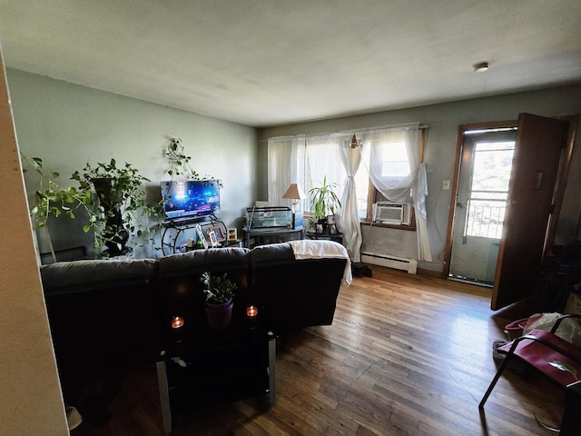 35 King Arthur Ct Unit 19, Northlake, IL 60164 - living area featuring a baseboard heating unit, healthy amount of natural light, wood finished floors, and cooling unit