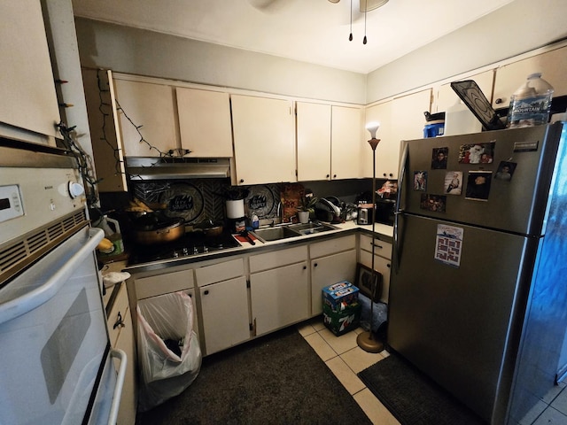 35 King Arthur Ct Unit 19, Northlake, IL 60164 - kitchen featuring freestanding refrigerator, oven, under cabinet range hood, white cabinets, and black cooktop