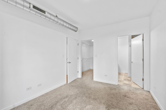 4537 S Drexel Blvd Unit 504, Chicago, IL 60653 - unfurnished bedroom featuring carpet and a walk in closet