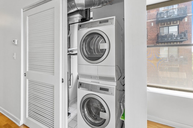 4537 S Drexel Blvd Unit 504, Chicago, IL 60653 - laundry area featuring stacked washer and clothes dryer and wood finished floors
