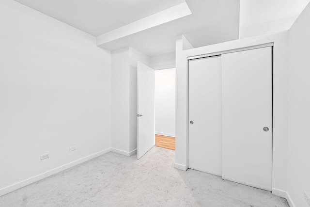 4537 S Drexel Blvd Unit 504, Chicago, IL 60653 - unfurnished bedroom featuring light colored carpet and a closet