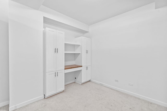 4537 S Drexel Blvd Unit 504, Chicago, IL 60653 - unfurnished bedroom with light colored carpet and built in study area