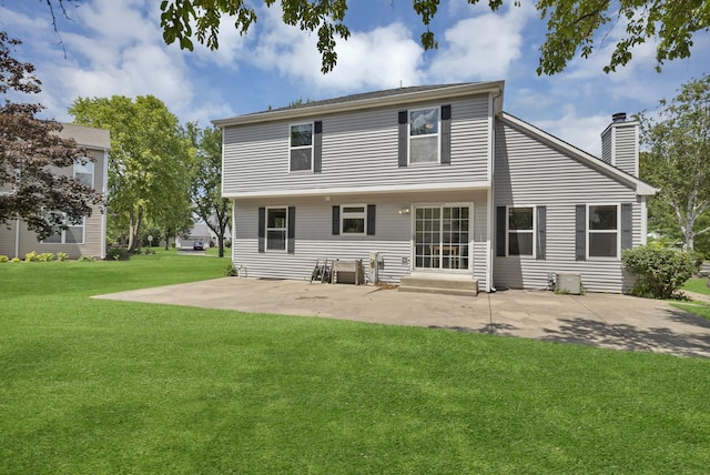 1439 Blue Heron Dr, Crystal Lake, IL 60014 - back of house with a patio, a yard, and a chimney