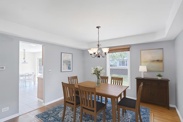 1439 Blue Heron Dr, Crystal Lake, IL 60014 - dining room with a chandelier and light wood-style floors