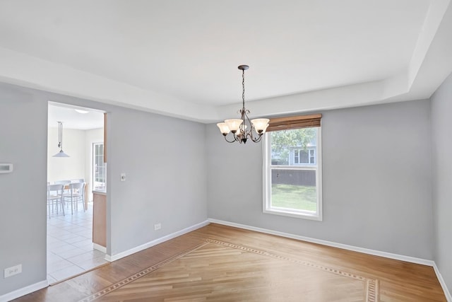 1439 Blue Heron Dr, Crystal Lake, IL 60014 - empty room with wood finished floors and a chandelier