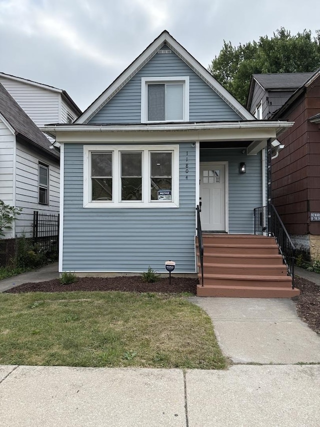 11804 S State St, Chicago, IL 60628 - bungalow-style house featuring a front lawn