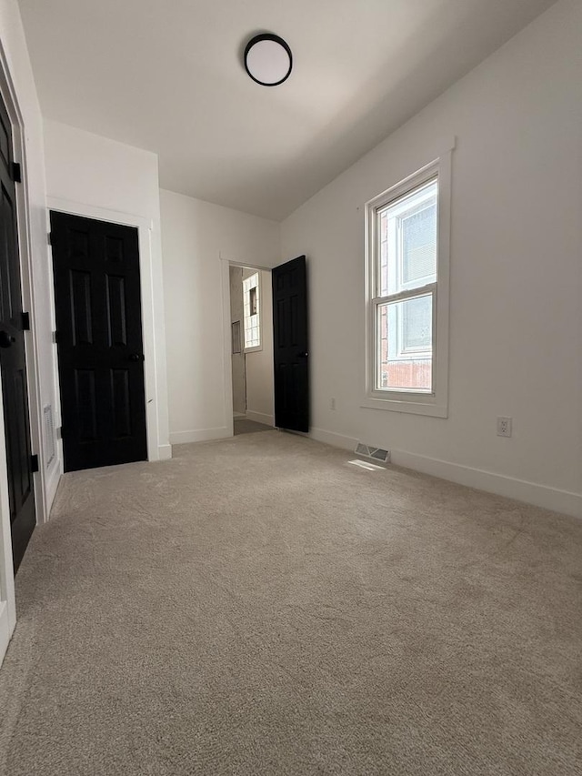 11804 S State St, Chicago, IL 60628 - unfurnished bedroom with light carpet