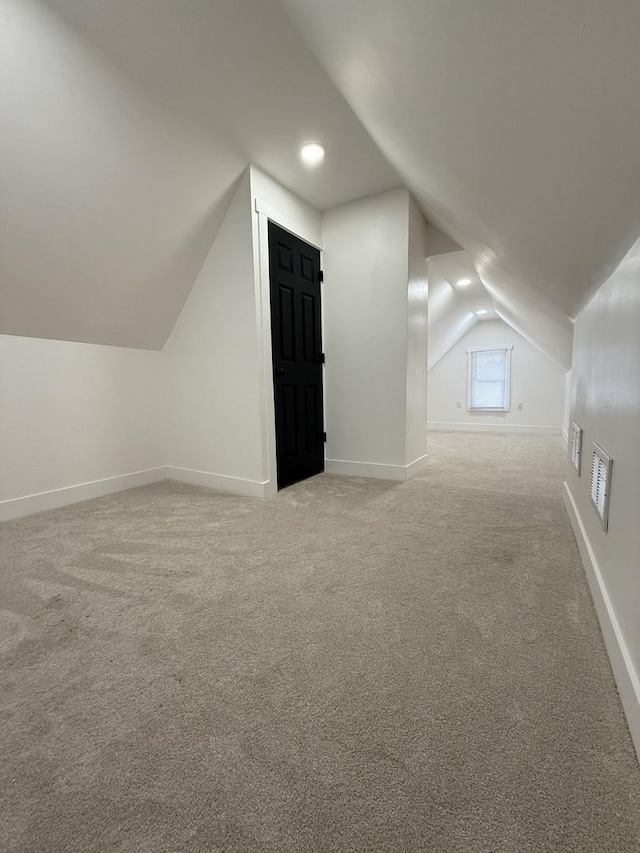 11804 S State St, Chicago, IL 60628 - additional living space with lofted ceiling, light colored carpet, and recessed lighting