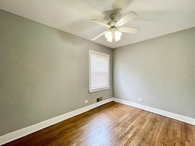 132 W 126th Pl, Chicago, IL 60628 - spare room featuring wood finished floors and a ceiling fan