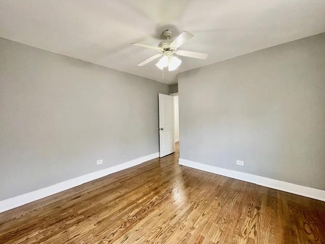 132 W 126th Pl, Chicago, IL 60628 - unfurnished room featuring ceiling fan and wood finished floors