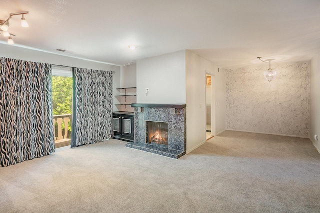 321 Woodbury Ct Unit D2, Schaumburg, IL 60193 - unfurnished living room featuring carpet flooring and a fireplace