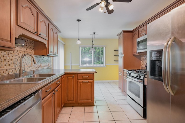 321 Woodbury Ct Unit D2, Schaumburg, IL 60193 - kitchen with appliances with stainless steel finishes, a peninsula, ceiling fan, backsplash, and brown cabinets
