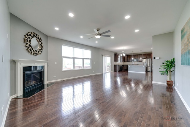 621 Blazing Star Dr, Lake Villa, IL 60046 - unfurnished living room featuring ceiling fan, recessed lighting, a fireplace with flush hearth, and dark wood-style floors