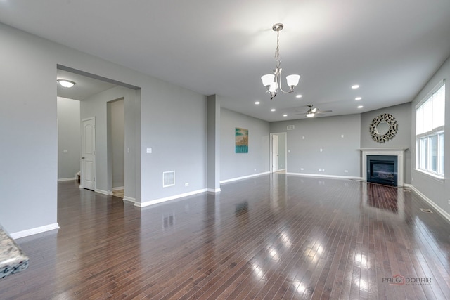 621 Blazing Star Dr, Lake Villa, IL 60046 - unfurnished living room with a ceiling fan, a glass covered fireplace, dark wood-style floors, a chandelier, and recessed lighting
