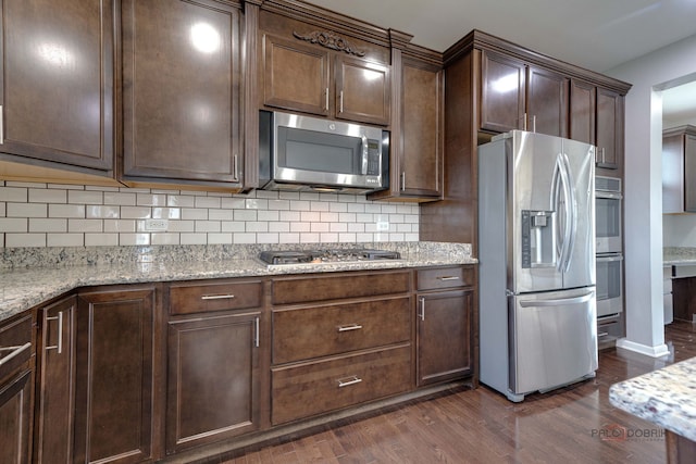 621 Blazing Star Dr, Lake Villa, IL 60046 - kitchen with stainless steel appliances, dark wood-style flooring, tasteful backsplash, and dark brown cabinets