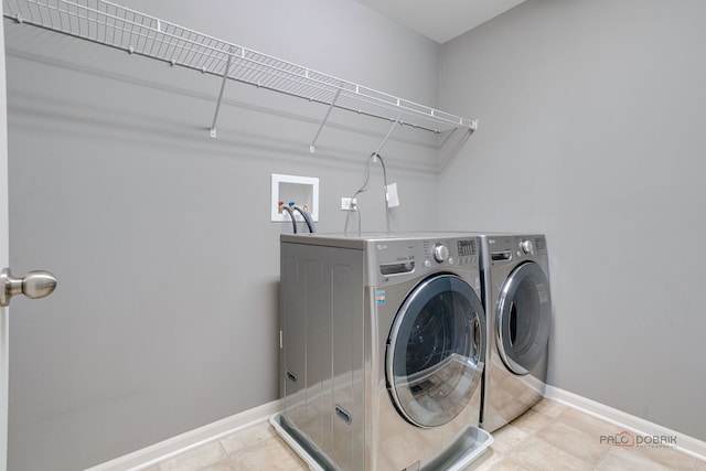 621 Blazing Star Dr, Lake Villa, IL 60046 - laundry room with washing machine and dryer and tile patterned flooring