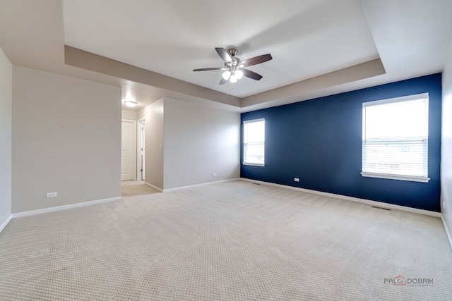 621 Blazing Star Dr, Lake Villa, IL 60046 - unfurnished room with a ceiling fan, a raised ceiling, and carpet flooring