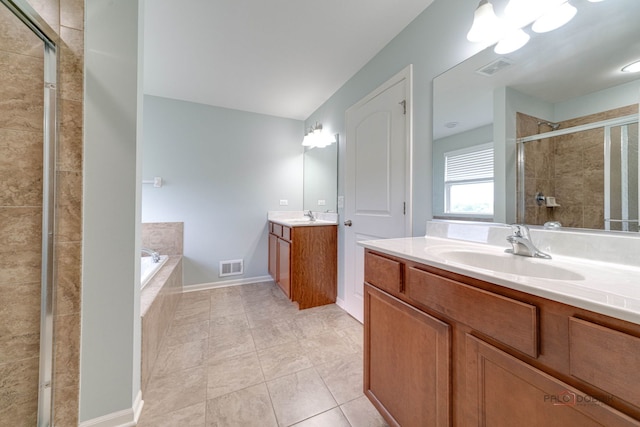 621 Blazing Star Dr, Lake Villa, IL 60046 - full bath with two vanities, a shower stall, a bath, and tile patterned floors