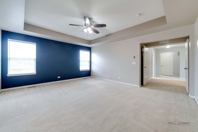 621 Blazing Star Dr, Lake Villa, IL 60046 - spare room with ceiling fan, a raised ceiling, light colored carpet, and a smoke detector