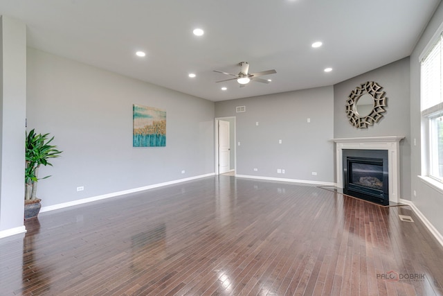 621 Blazing Star Dr, Lake Villa, IL 60046 - unfurnished living room featuring ceiling fan, wood finished floors, a fireplace with flush hearth, and recessed lighting