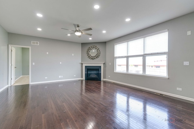 621 Blazing Star Dr, Lake Villa, IL 60046 - unfurnished living room featuring a ceiling fan, dark wood-style floors, a fireplace with flush hearth, and recessed lighting
