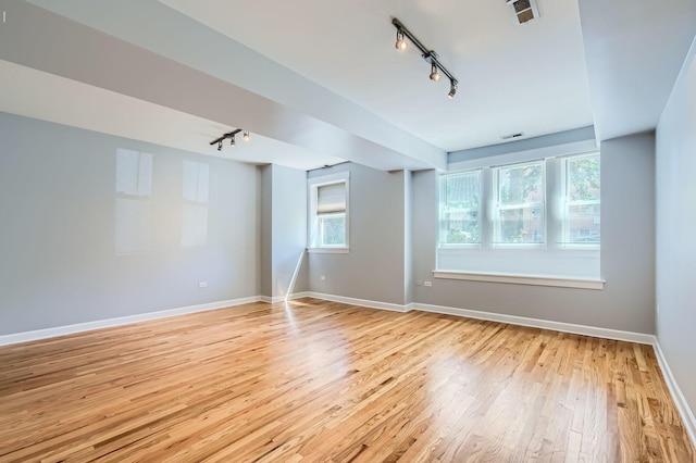 4056 N Albany Ave Unit G, Chicago, IL 60618 - empty room featuring rail lighting and light wood-style flooring
