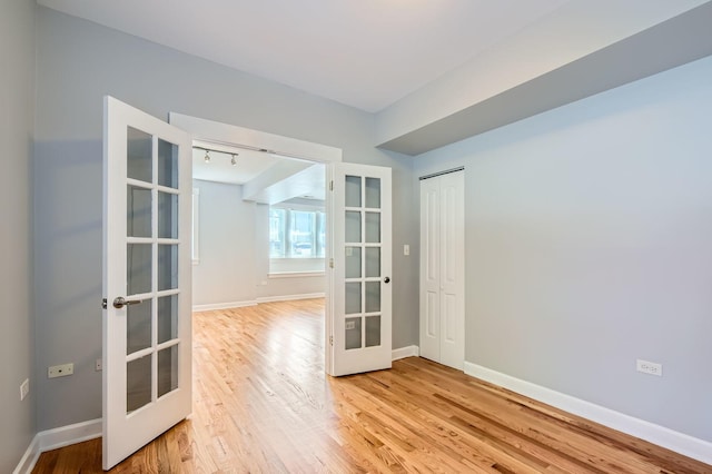 4056 N Albany Ave Unit G, Chicago, IL 60618 - unfurnished room featuring french doors and light wood-style flooring