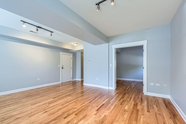 4056 N Albany Ave Unit G, Chicago, IL 60618 - unfurnished room with rail lighting and light wood-style flooring
