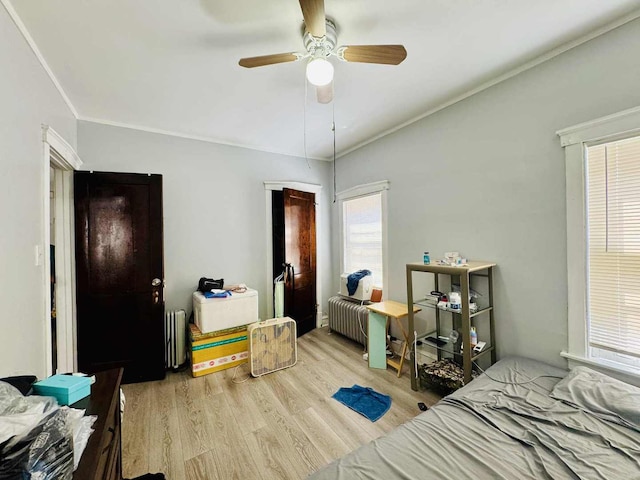 5221 W Montrose Ave, Chicago, IL 60641 - bedroom with radiator, wood finished floors, a ceiling fan, and ornamental molding