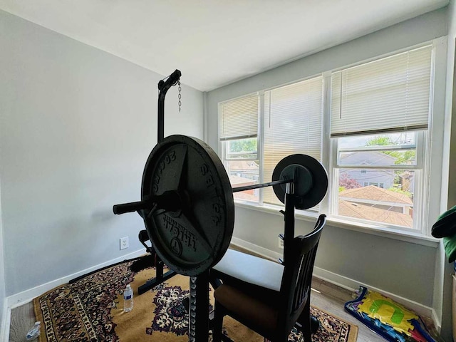 5221 W Montrose Ave, Chicago, IL 60641 - workout area with baseboards and wood finished floors