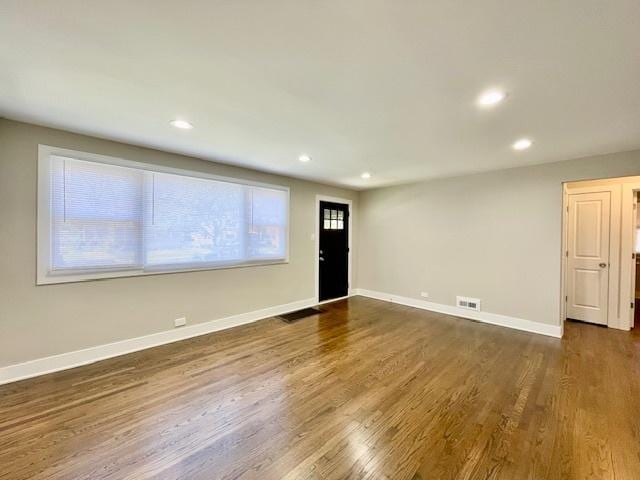 10049 S Calhoun Ave, Chicago, IL 60617 - spare room with recessed lighting and dark wood-style floors